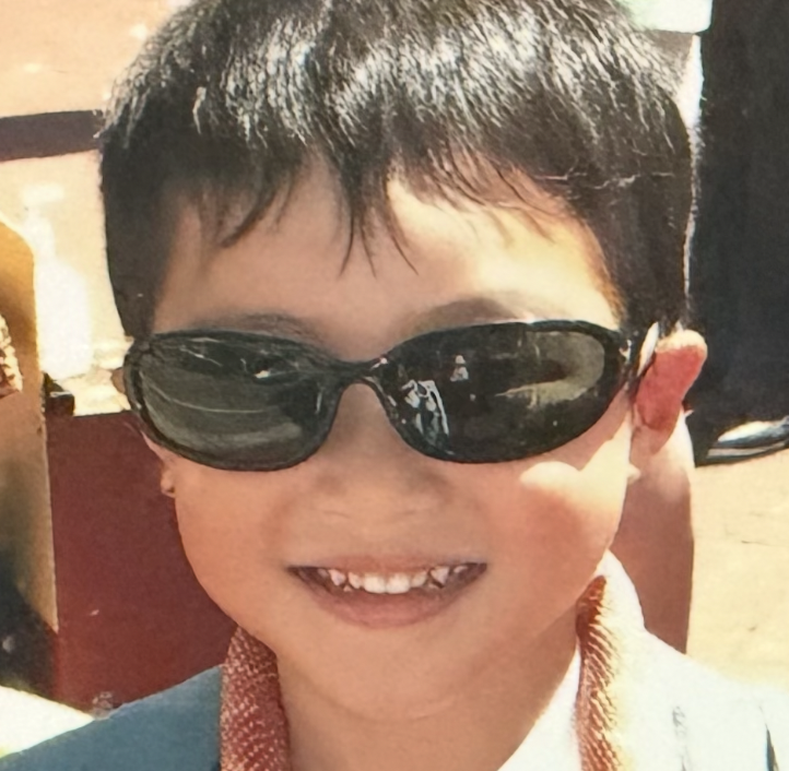 Max (xamnil) Lin as a child, wearing sunglasses